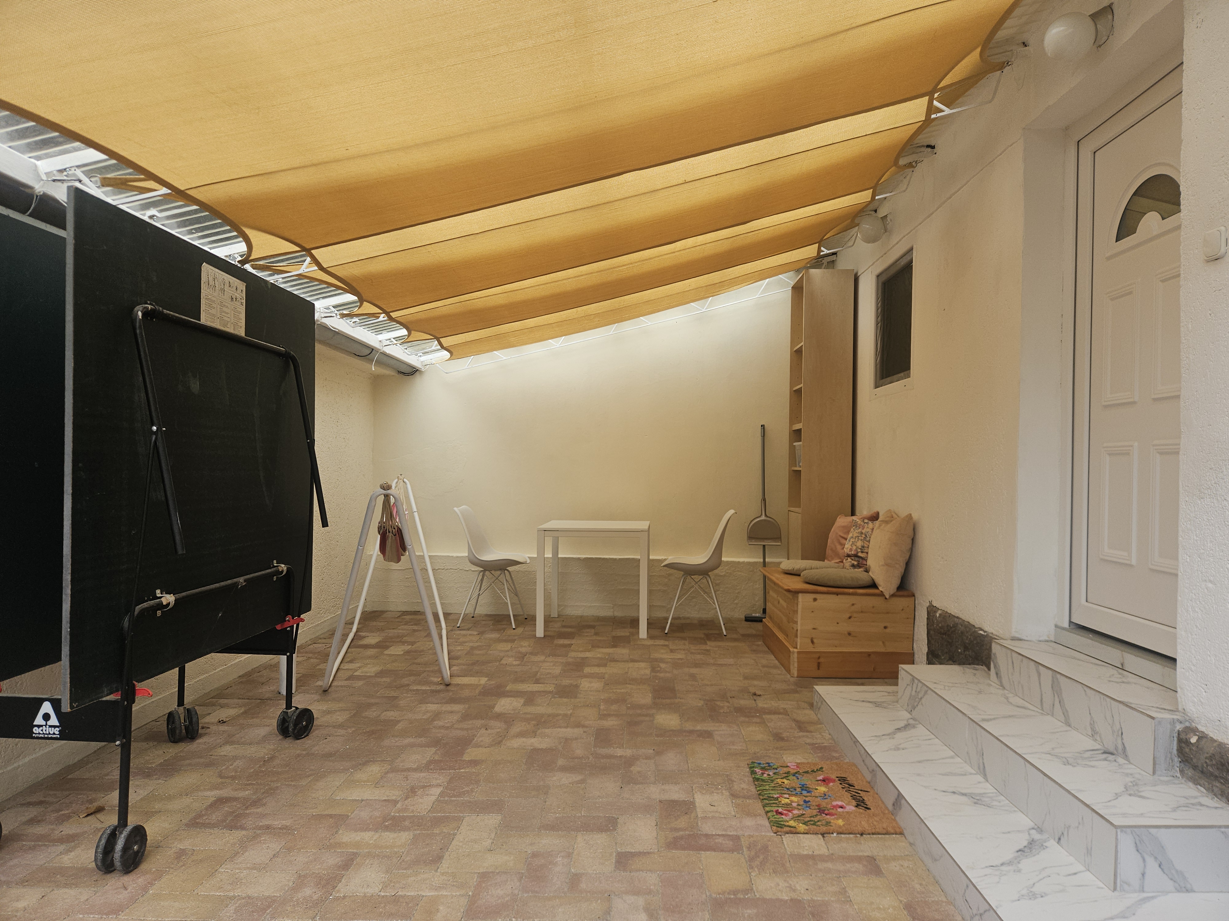 Covered terrace with outdoor seating area
