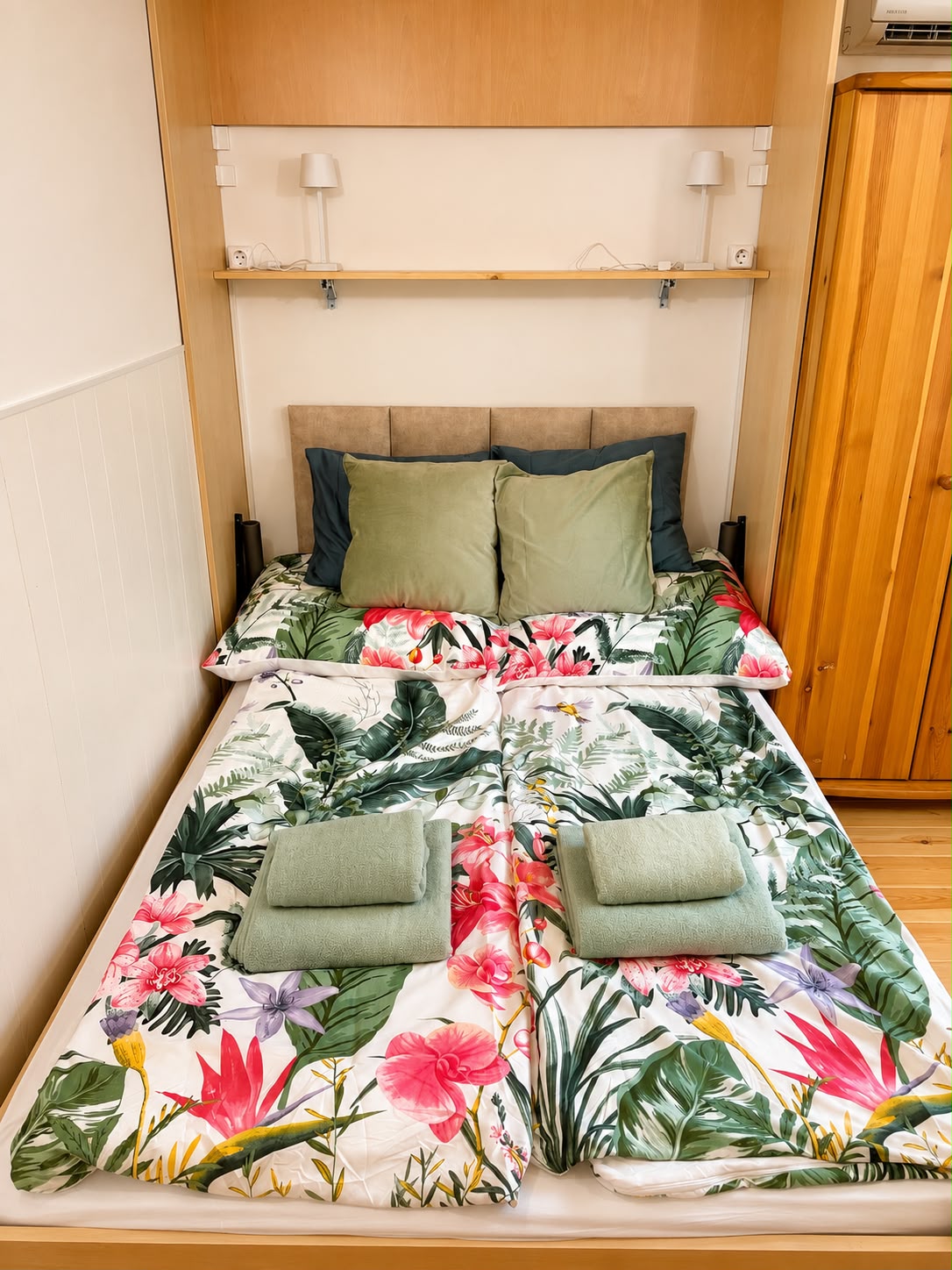 Double bed with floral linen
